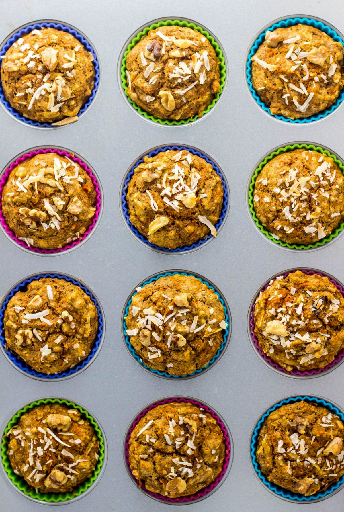 Overhead view of Whole Wheat Carrot Cake Muffins in a muffin pan.