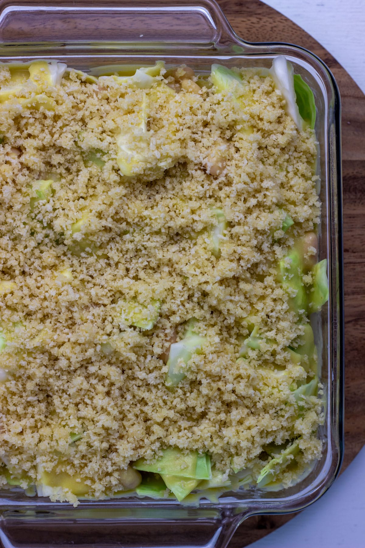 Close up overhead view of Vegan Scalloped Cabbage and Beans before baking.