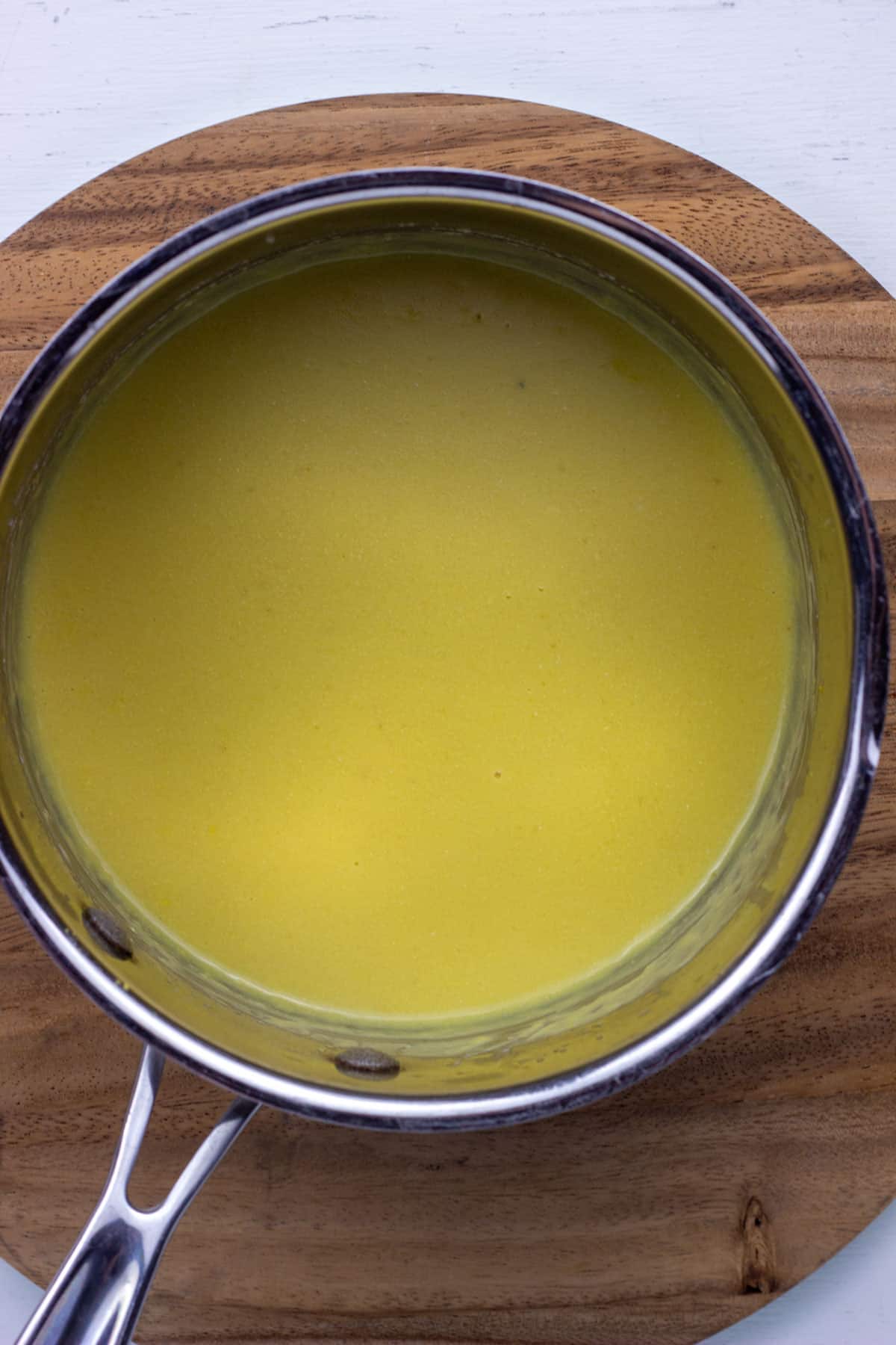 Overhead view of a pot of sauce to make Vegan Scalloped Cabbage and Beans.