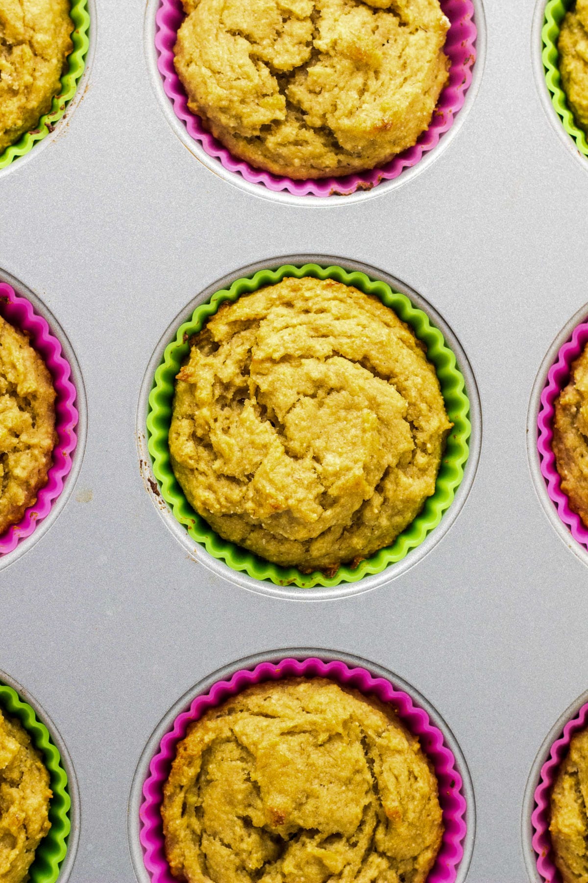 Close up overhead view of muffins in a baking pan.