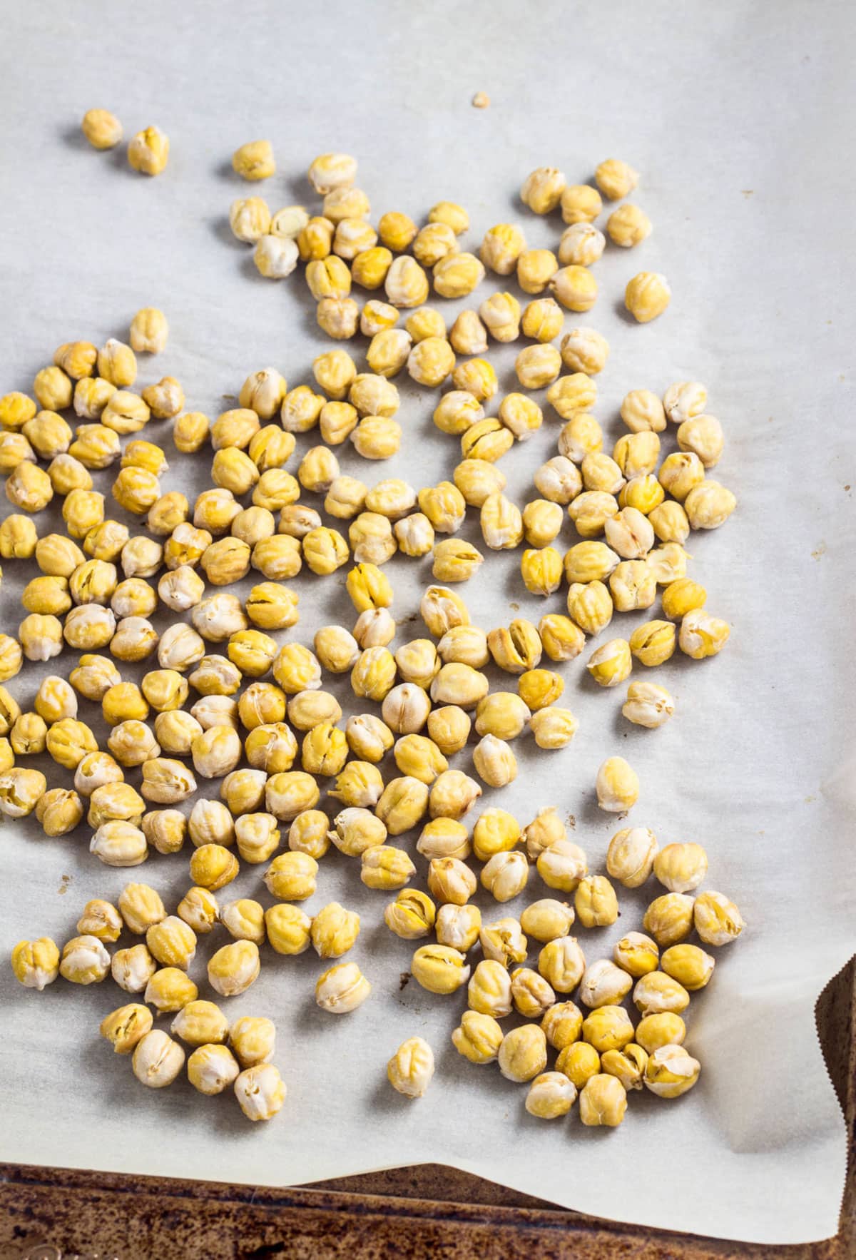 Beans on a baking sheet after roasting.
