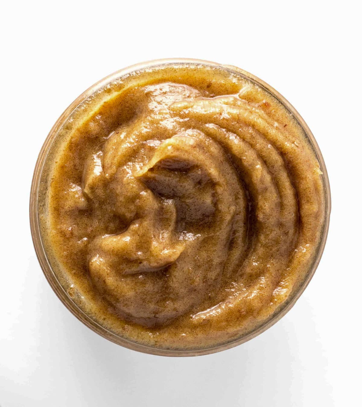 Overhead shot of a jar of date paste. Date paste is dates blended with water until smooth and creamy.