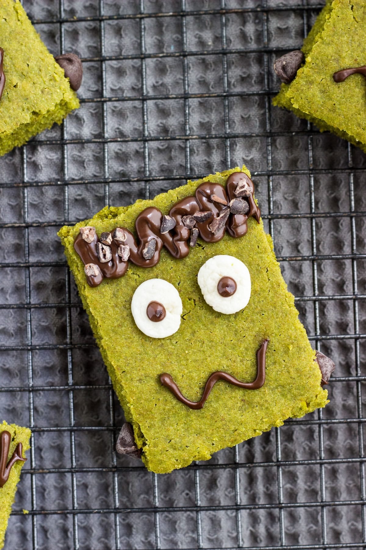 Close up of Vegan Frankenstein Snack Cake on a wire cooling rack.